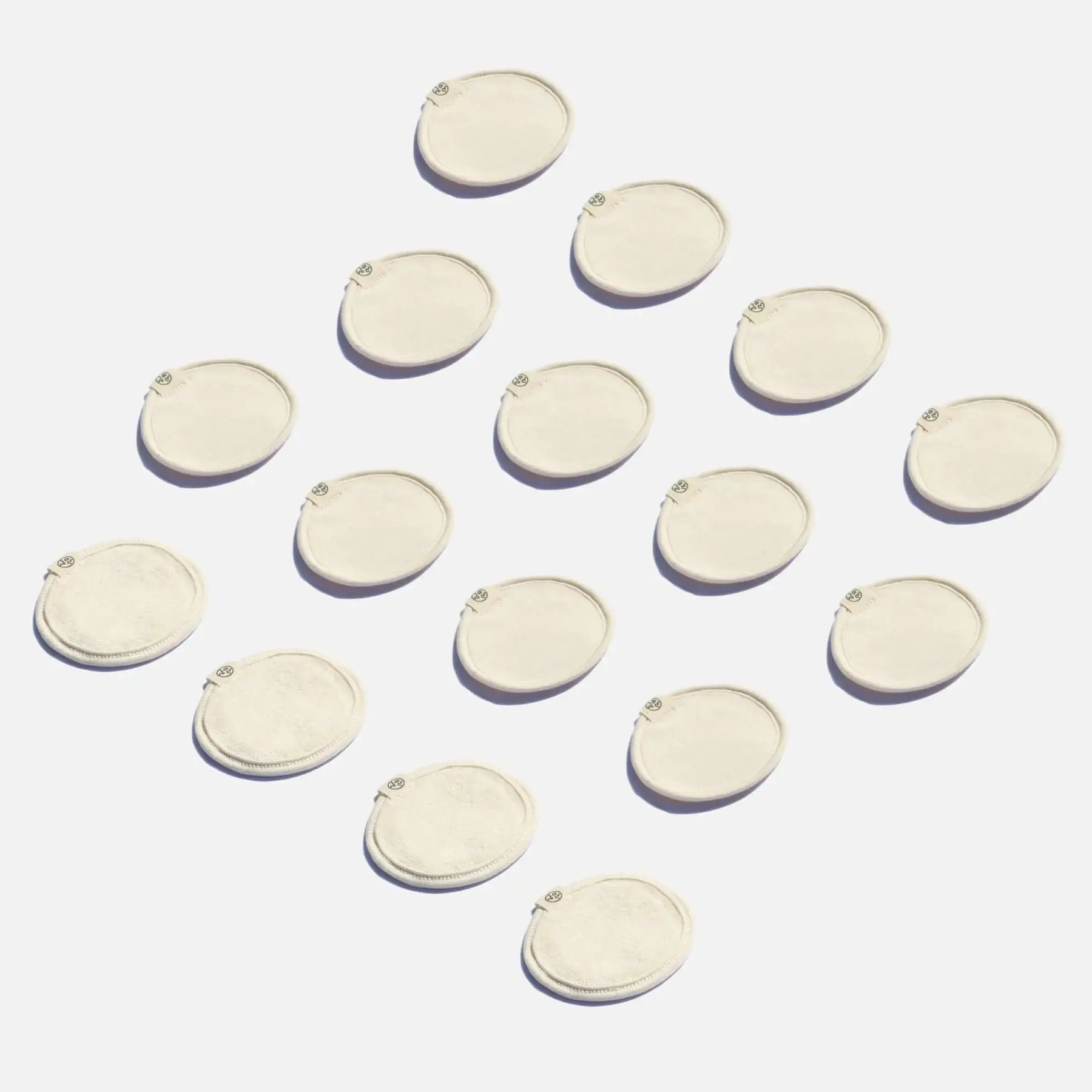 Round shaped organic make-up removal pads against a light background