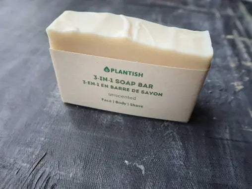 Plantish 3-in-1 soap bar on a dark textured surface