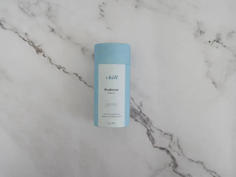 Deodorant can labeled 'chill' on a marble surface