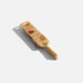 A wooden cooking utensils displayed with its eco-friendly packaging, emphasizing sustainable product characteristics.