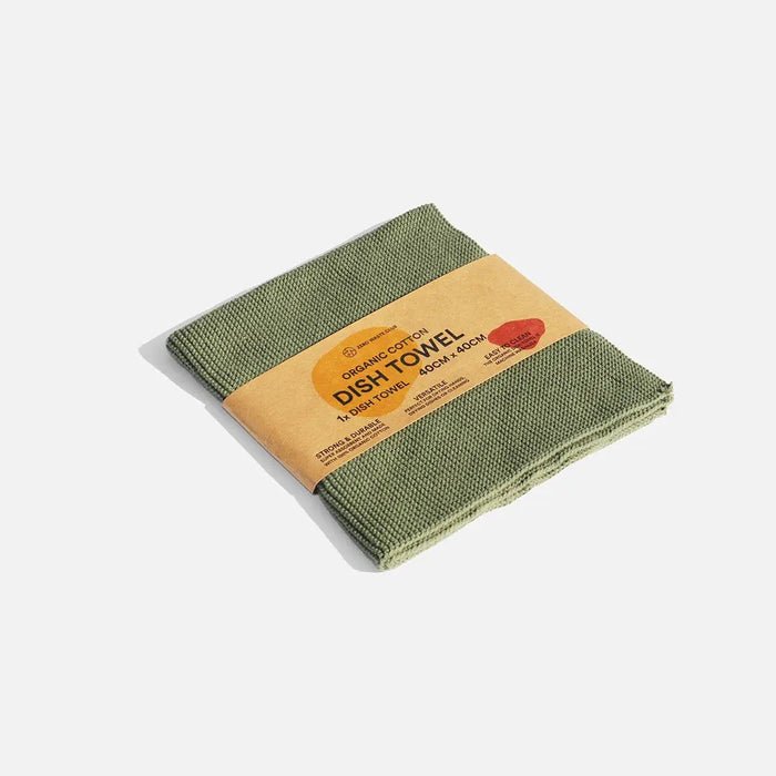 Green dish towel with a brown paper label on a white background