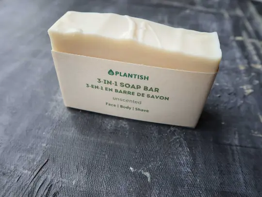 Plantish 3-in-1 soap bar on a dark textured surface