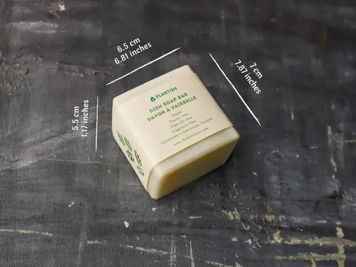 Bar of soap with dimensions labeled on a dark textured background